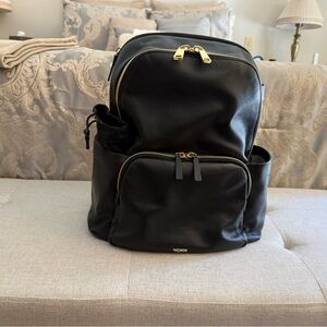 Tumi Black Backpack with Gold Details